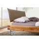 Lit design en bois massif et pieds en verre