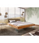 Lit design en bois massif et pieds en verre