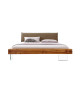 Lit design en bois massif et pieds en verre